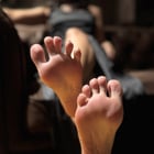 bold close up black pedicure and soft soles 🖤
