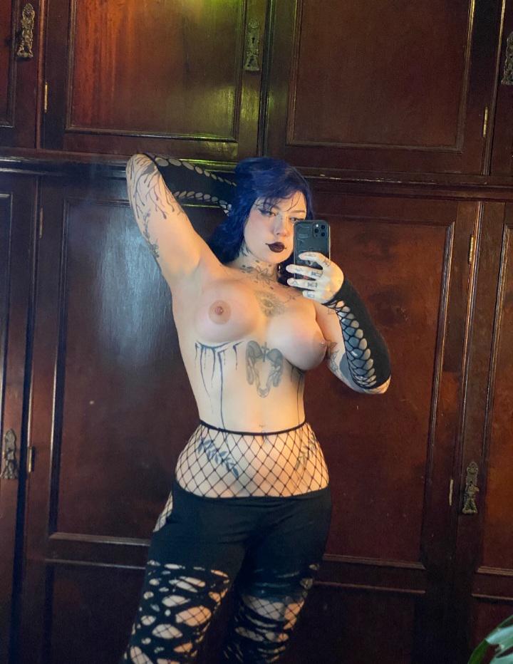 This goth mom loves showing off her breasts