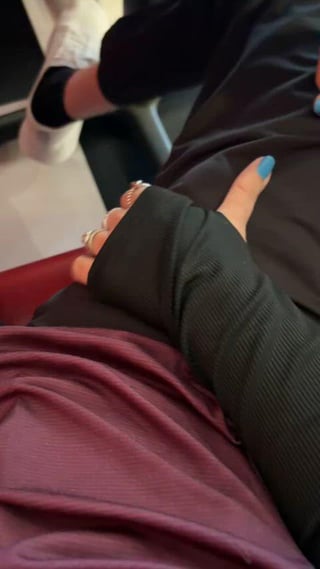 Stroking a new cock under the table