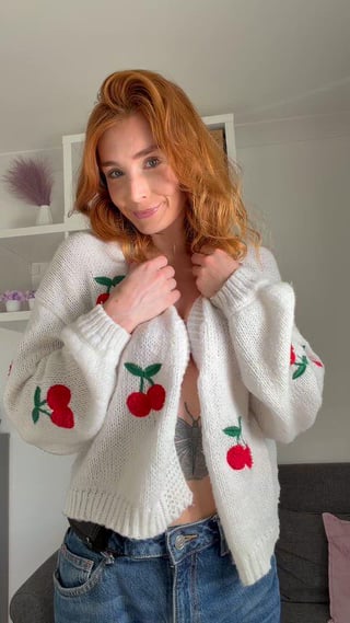 Cute redhead with perky pierced tits