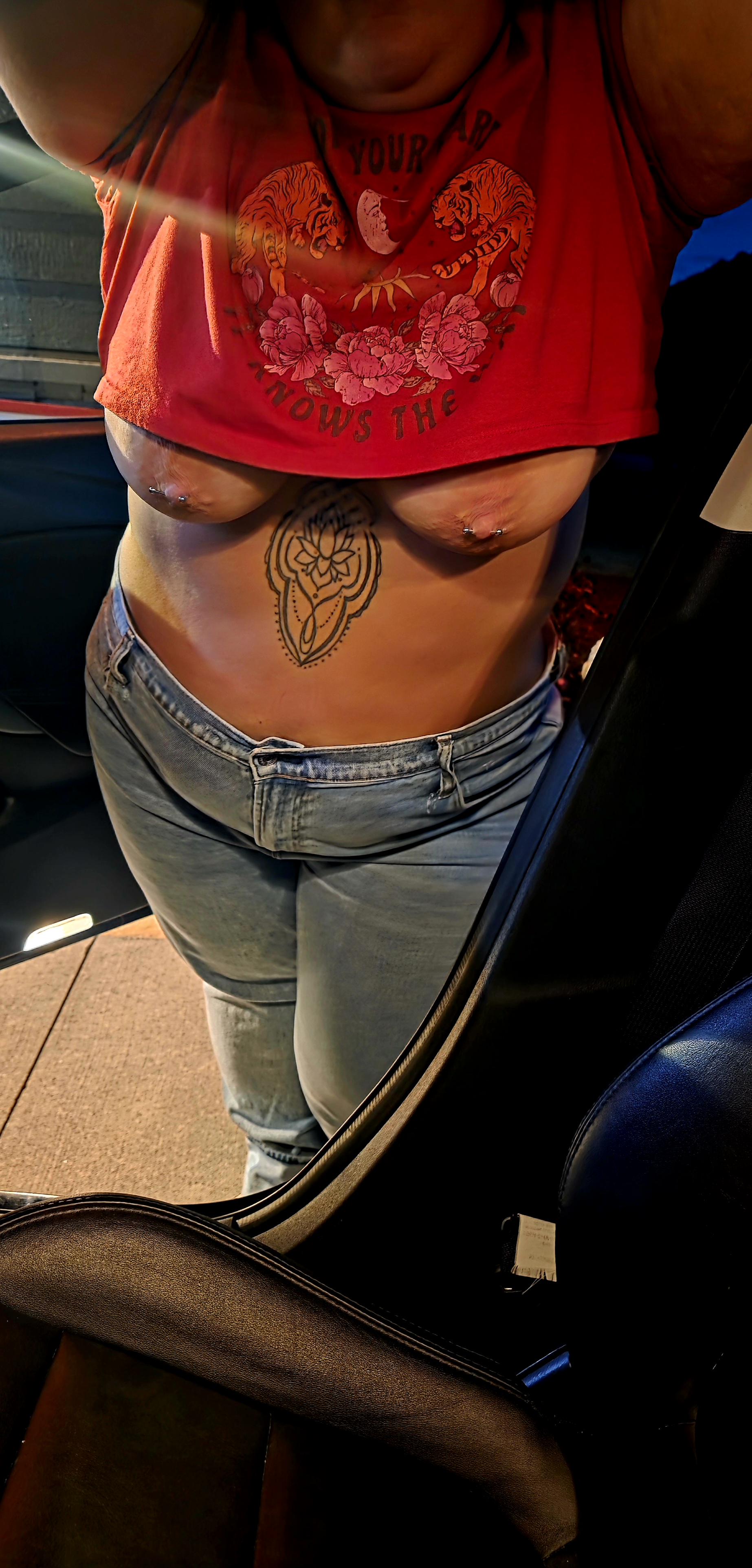Didn’t realize my nips were out leaning on the car.